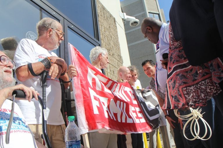 A senior citizen's group called The Old Farts were arrested in front of Philadelphia’s ICE headquarters Friday morning in protest of the Trump administration’s family separation policy. (Kimberly Paynter/WHYY)