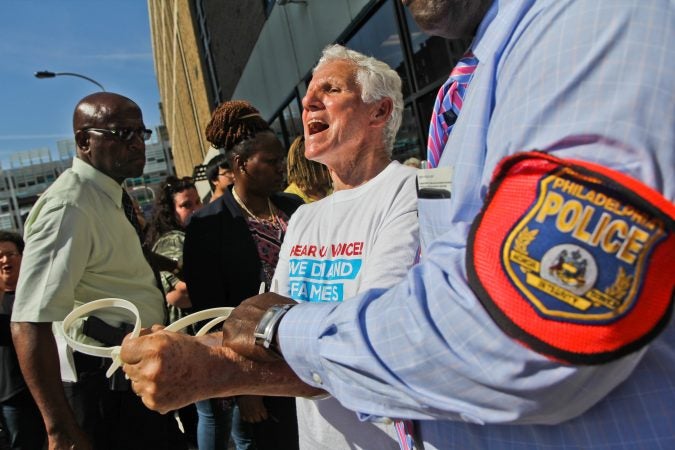 A senior citizen's group called The Old Farts were arrested in front of Philadelphia’s ICE headquarters Friday morning in protest of the Trump administration’s family separation policy. (Kimberly Paynter/WHYY)