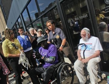 A senior citizen's group called The Old Farts were arrested in front of Philadelphia’s ICE headquarters Friday morning in protest of the Trump administration’s family separation policy. (Kimberly Paynter/WHYY)