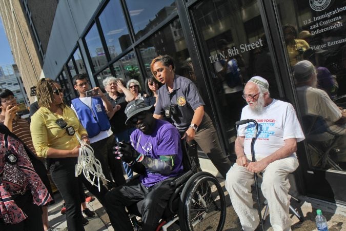 A senior citizen's group called The Old Farts were arrested in front of Philadelphia’s ICE headquarters Friday morning in protest of the Trump administration’s family separation policy. (Kimberly Paynter/WHYY)