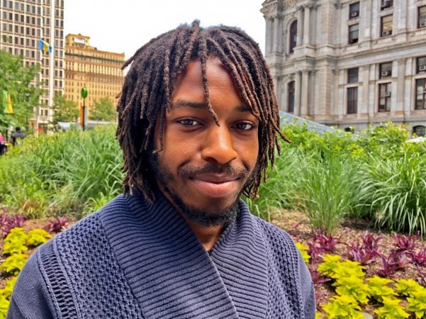 Tyquan McCray, 23, currently does deliveries for UberEats as he searches for a job that he feels is right for him. (Darryl Murphy/for WHYY)