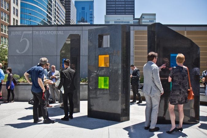 A memorial is dedicated on the fifth anniversary of a building collapse at 22nd and Market streets that killed six people. (Kimberly Paynter/WHYY)