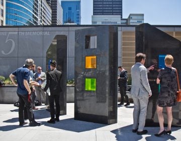 A memorial is dedicated on the fifth anniversary of a building collapse at 22nd and Market Streets that killed six people. (Kimberly Paynter/WHYY)