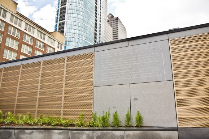 A memorial is dedicated on the fifth anniversary of a building collapse at 22nd and Market streets that killed six people. (Kimberly Paynter/WHYY)