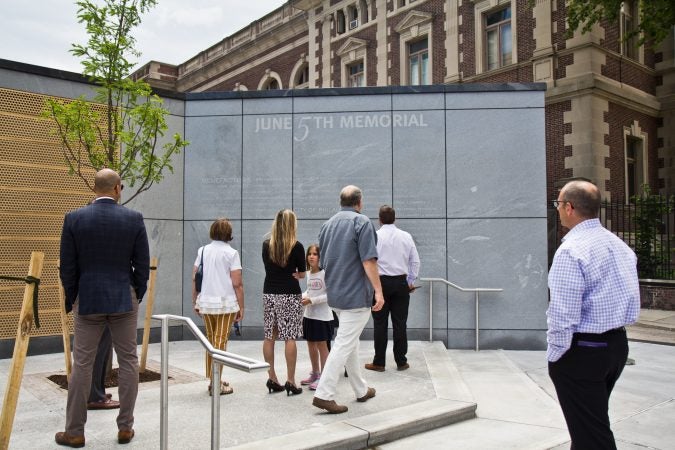 A memorial is dedicated on the fifth anniversary of a building collapse at 22nd and Market streets that killed six people. (Kimberly Paynter/WHYY)