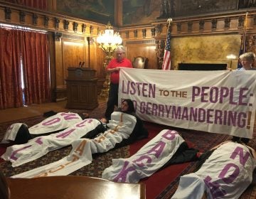 Amid chants and songs, sleeping bag-clad protesters sat up one by one to give speeches in favor of congressional and state district maps drawn by citizens, not politicians.