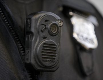 In this file photo, a Philadelphia Police officer demonstrates a body-worn camera used as part of a pilot project in December 2014, in Philadelphia. (Matt Rourke/AP Photo)