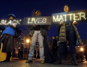 In this Dec. 4, 2014, file photo protesters rally in New York's Foley Square against a state grand jury's decision not to indict the police officer involved in the death of Eric Garner. (Jason DeCrow/AP Photo, File)