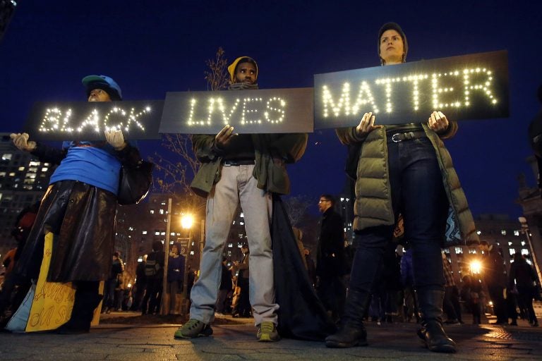 In this Dec. 4, 2014, file photo protesters rally in New York's Foley Square against a state grand jury's decision not to indict the police officer involved in the death of Eric Garner. (Jason DeCrow/AP Photo, File)