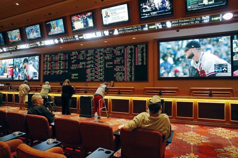 Bettors wager in the sports book at the South Point hotel and casino in Las Vegas. Now that the U.S. Supreme Court has cleared the way for states to legalize sports betting, Pennsylvania is reviewing applications from facilities that want to offer wagering on sports events. (John Locher/AP Photo)