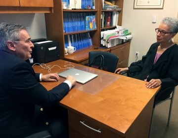 In this Thursday, May 24, 2018 photo, Adine Usher, 78, meets with breast cancer study leader Dr. Joseph Sparano at the Montefiore and Albert Einstein College of Medicine in the Bronx borough of New York. Usher was one of about 10,000 participants in the study which shows women at low or intermediate risk for breast cancer recurrence may safely skip chemotherapy without hurting their chances of survival. (AP Photo/Kathy Young)