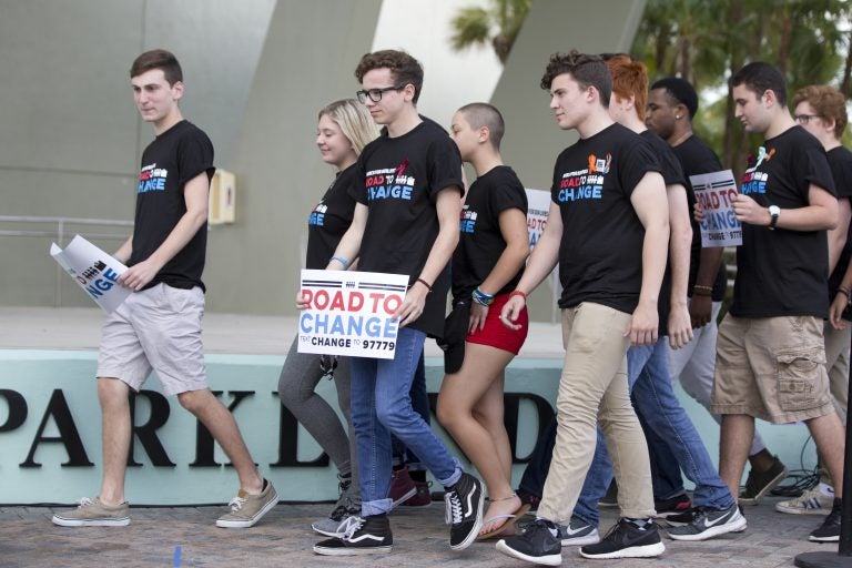 A group of Marjory Stoneman Douglas High School students arrive for a news conference, Monday, June 4, 2018, in Parkland, Fla. A day after graduating from high school, the group of Florida school shooting survivors has announced a multistate bus tour to 