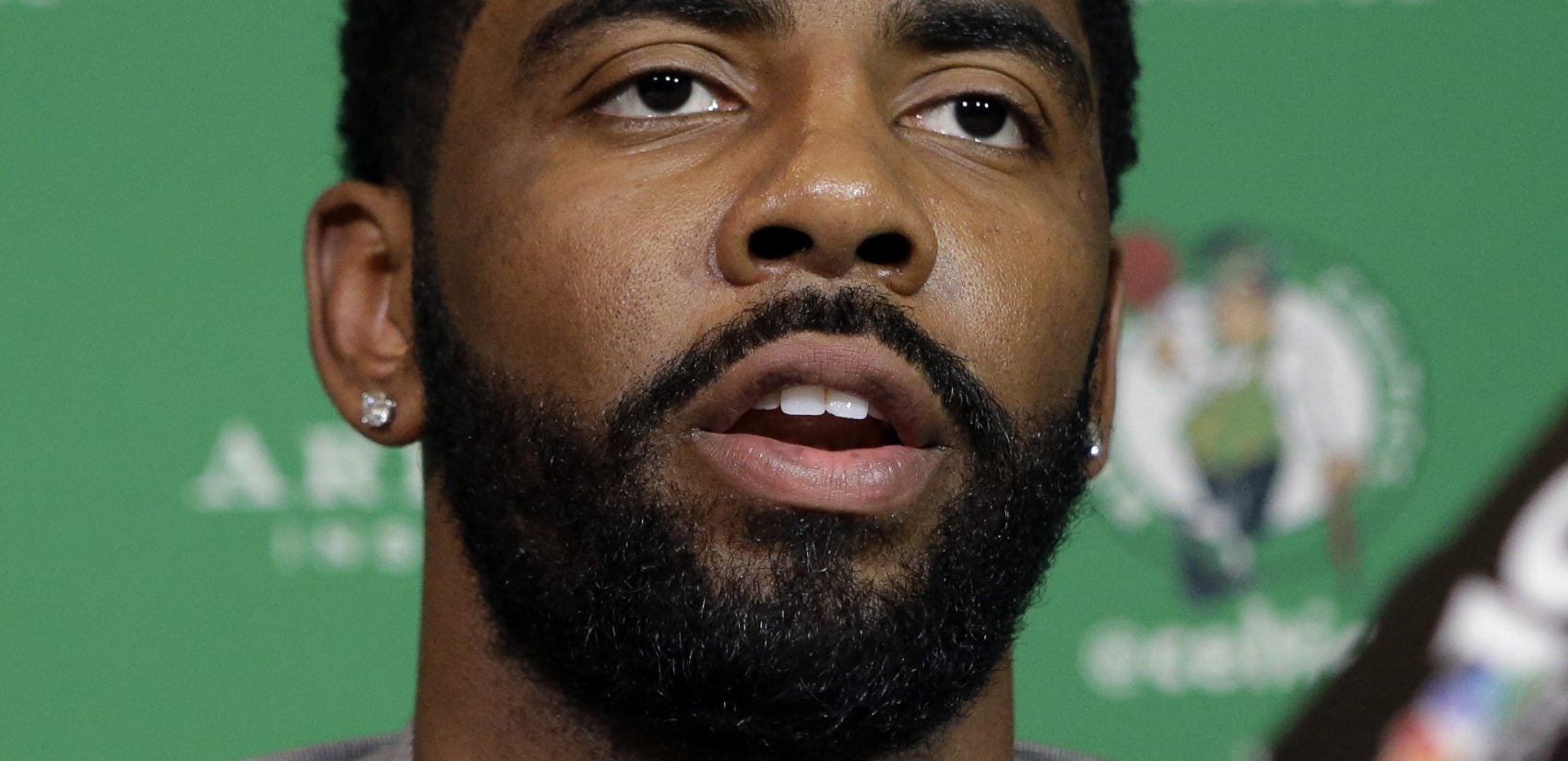 Boston Celtics' Kyrie Irving takes questions from reporters, Tuesday, June 12, 2018 during a news conference, in Boston. Irving spoke about the upcoming film 