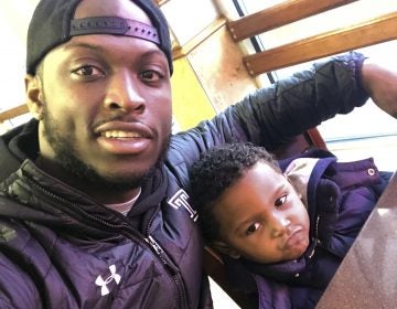 In this Feb. 10, 2018 photo, former Temple running back David Hood takes a selfie with his son, David IV in Mays Landing, N.J. Hood, who was Temple’s leading rusher last season, was one of four Owls players parenting young children in 2017. Hood, 21, has moved on from football, graduating from Temple and leaving a year of football eligibility behind after sustaining a concussion this past spring. He has decided to focus solely on a promising career as a rapper. (David Hood via AP)