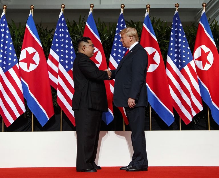 In this June 12, 2018, file photo, North Korean leader Kim Jong Un and U.S. President Donald Trump shake hands prior to their meeting on Sentosa Island in Singapore. (Evan Vucci/AP Photo, File)