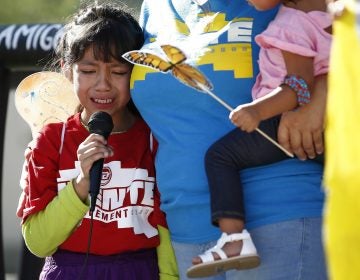 Akemi Vargas, 8, cries as she talks about being separated from her father