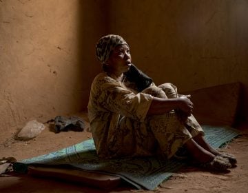 Janet Kamara, from Liberia, sits during an interview conducted in an International Organization for Migration transit center in Arlit, Niger on Saturday, June 2, 2018. Kamara was expelled from Algeria, and left stranded in the Sahara while pregnant. 
