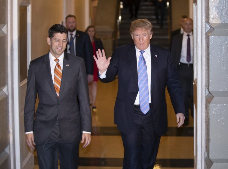 Speaker of the House Paul Ryan, R-Wis., left, walks with President Donald Trump as they head to a meeting of House Republicans to discuss a GOP immigration bill at the Capitol in Washington, Tuesday, June 19, 2018.