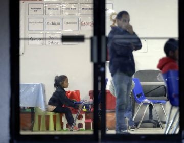 Immigrants recently processes and released by U.S. Customs and Border Protection wait at the the Catholic Charities RGV, Wednesday, June 20, 2018, in McAllen, Texas. Nearly 2,000 children have been separated from their families at the U.S. border over a six-week period during a crackdown on illegal entries, according to Department of Homeland Security figures obtained Friday by The Associated Press. (AP Photo/Eric Gay)