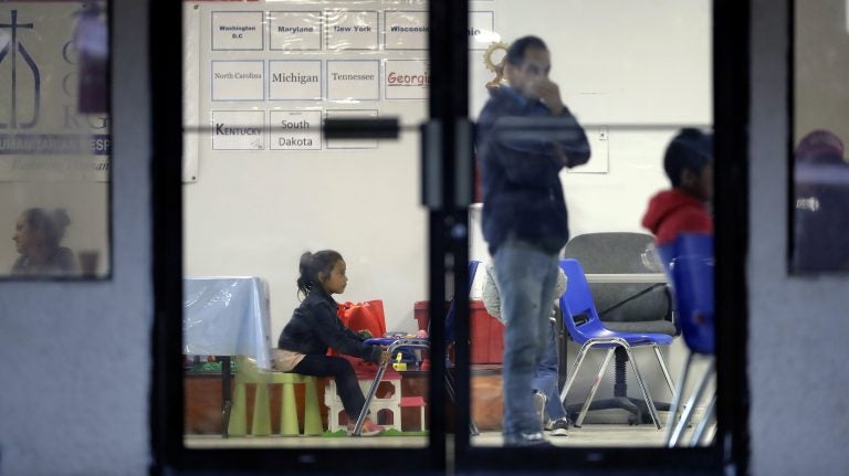 Immigrants recently processes and released by U.S. Customs and Border Protection wait at the the Catholic Charities RGV, Wednesday, June 20, 2018, in McAllen, Texas. Nearly 2,000 children have been separated from their families at the U.S. border over a six-week period during a crackdown on illegal entries, according to Department of Homeland Security figures obtained Friday by The Associated Press. (AP Photo/Eric Gay)