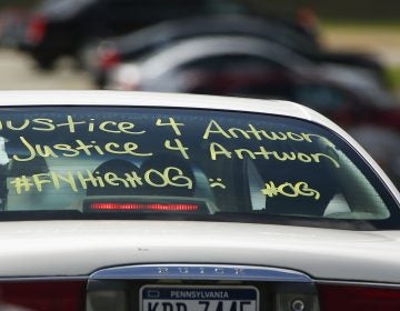 One of the vehicles in the funeral procession for Antwon Rose Jr. has a message displayed as it arrives at the Woodland Hills Intermediate school on Monday, June 25, 2018, in Swissvale, Pa. Rose was fatally shot by a police officer seconds after he fled a traffic stop June 19, in the suburb of East Pittsburgh. (AP Photo/Keith Srakocic)