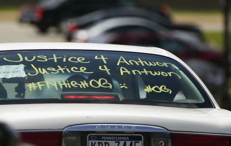 One of the vehicles in the funeral procession for Antwon Rose Jr. has a message displayed as it arrives at the Woodland Hills Intermediate school on Monday, June 25, 2018, in Swissvale, Pa. Rose was fatally shot by a police officer seconds after he fled a traffic stop June 19, in the suburb of East Pittsburgh. (AP Photo/Keith Srakocic)