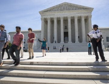 Visitors depart the Supreme Court early Monday, June 25, 2018. The justices upheld the Trump administration's travel ban on Tuesday. (AP Photo/J. Scott Applewhite)