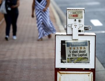 A Capital Gazette newspaper rack displays the day's front page, Friday, June 29, 2018, in Annapolis, Md. A man armed with smoke grenades and a shotgun attacked journalists in the newspaper's building Thursday, killing several people before police quickly stormed the building and arrested him, police and witnesses said. (Patrick Semansky/AP Photo)