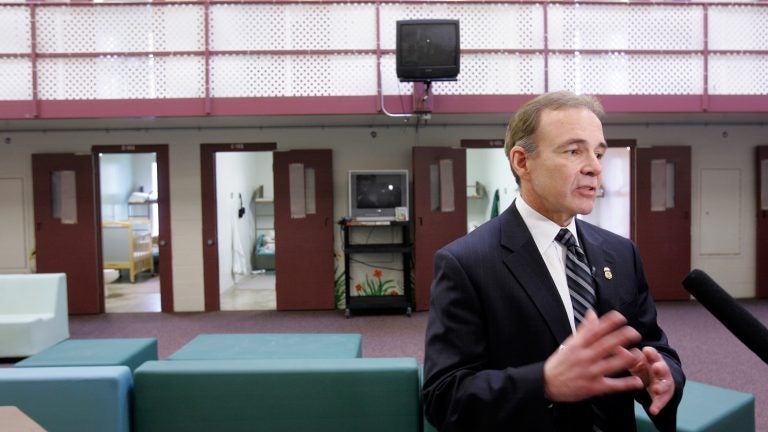 Garry Mead, assistant director of detention and removal for Immigration and Customs Enforcement, answers a reporter’s question in 2007 in front of cells that housed immigrant families at the T. Don Hutto Residential Center in Taylor, Texas. After a suit by the ACLU, the center ended family detention, and ICE mostly avoided it until 2014. Garry Mead, assistant director of detention and removal for Immigration and Customs Enforcement, answers a reporter's question in 2007 in front of cells that housed immigrant families at the T. Don Hutto Residential Center in Taylor, Texas. After a suit by the ACLU, the center ended family detention, and ICE mostly avoided it until 2014. (LM Otero/AP)