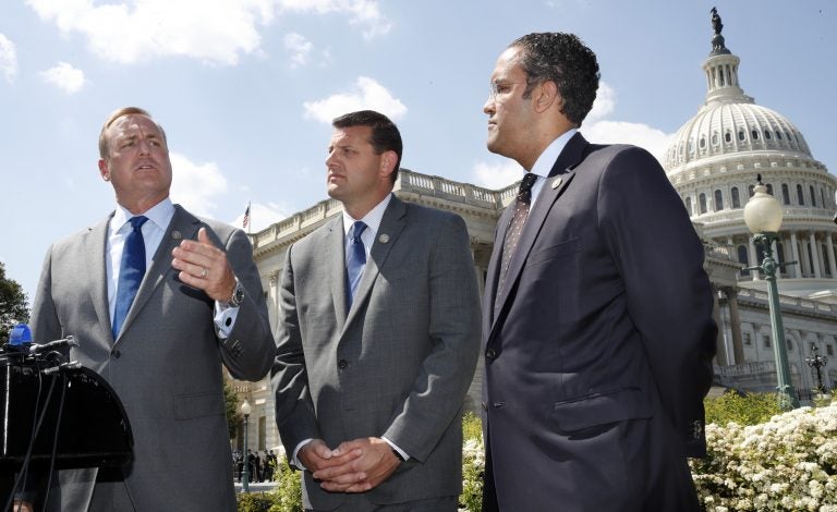 Rep. Jeff Denham, R-Calif., left, speaks next to Rep. David Valadao, R-Calif., and Rep. Will Hurd, R-Texas, during a May 9, 2018 news conference on a discharge petition to force votes on immigration legislatio