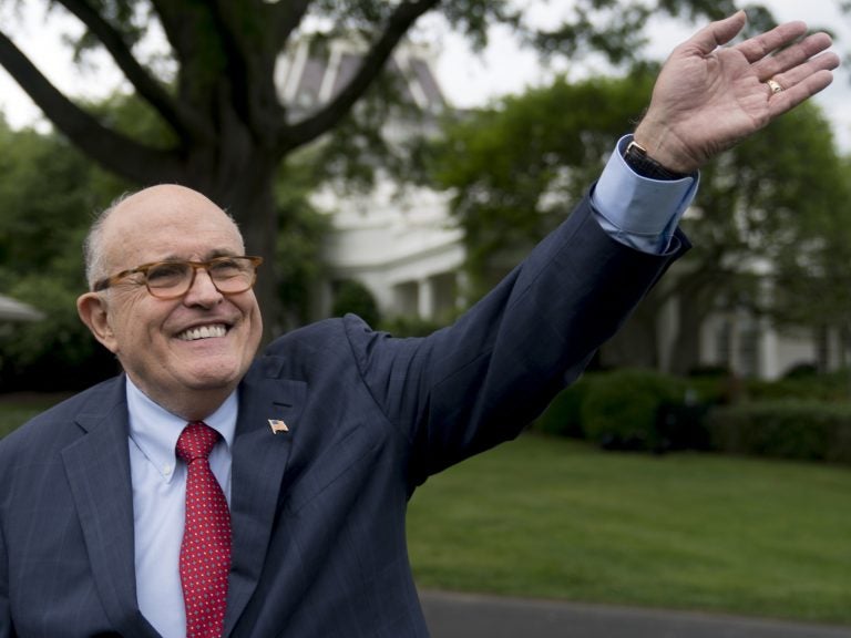 Rudy Giuliani, an attorney for President Donald Trump, waves to people during White House Sports and Fitness Day on the South Lawn of the White House, on Tuesday in Washington.