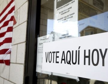 A sign announces a polling place in Spanish outside of the Harrison Community Center during New Jersey's primary election June 5. (Julio Cortez/AP)