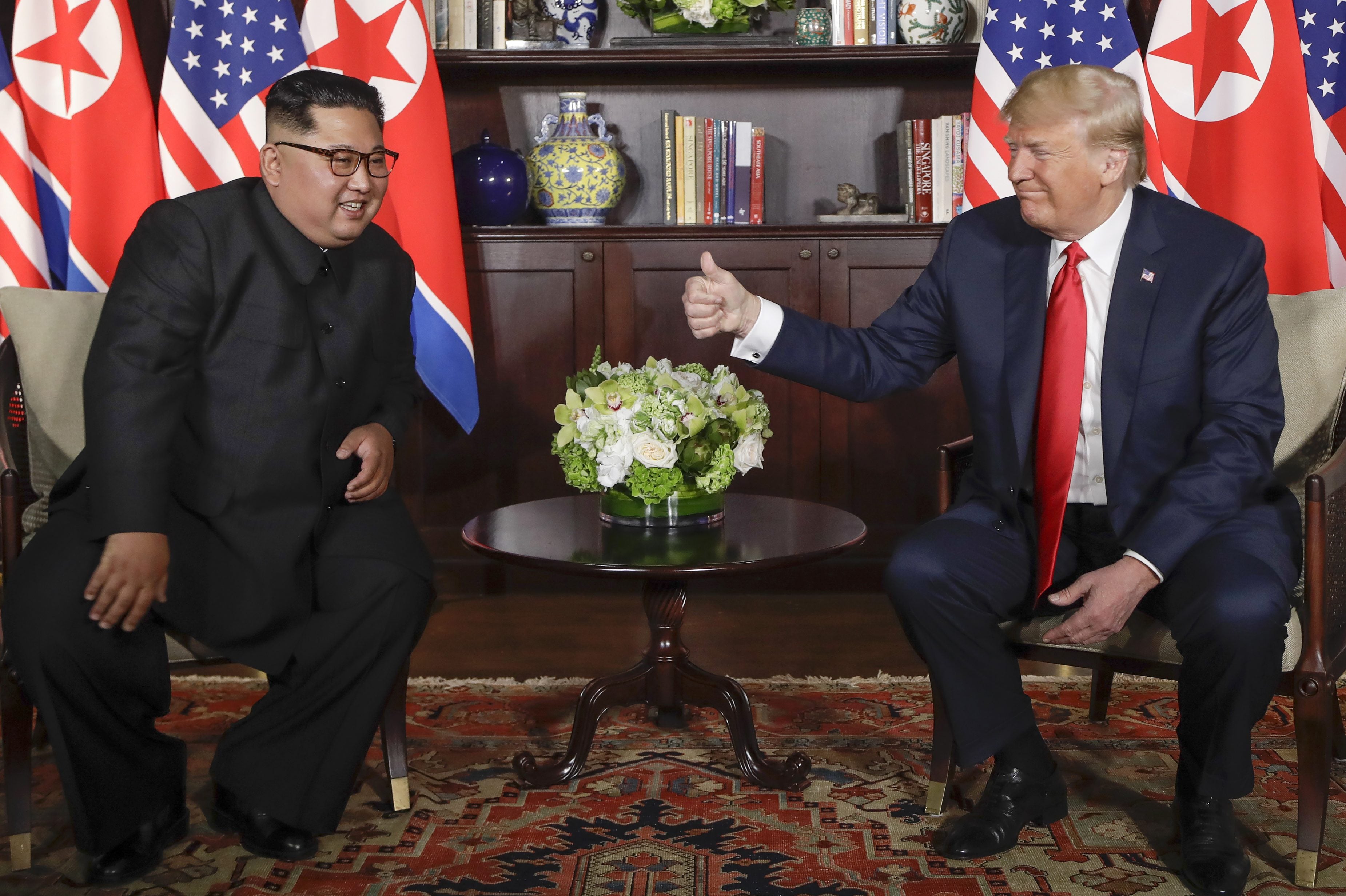 President Trump gives North Korea leader Kim Jong Un a thumbs up at their meeting at the Capella resort on Sentosa Island in Singapore on Tuesday