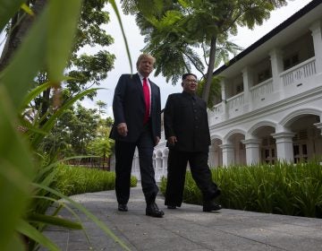 President Trump walks with North Korean leader Kim Jong Un on Tuesday on Sentosa Island in Singapore.