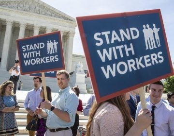 People gather at the Supreme Court awaiting a decision in an Illinois union dues case, Janus v. AFSCME, on Monday. (J. Scott Applewhite/AP)