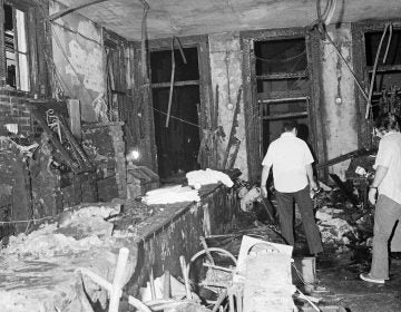 A view inside the Up Stairs bar following a fire that left 32 dead and several more injured, seen on June 25, 1973. Most of the victims were found near the windows in the background. (Jack Thornell/AP)