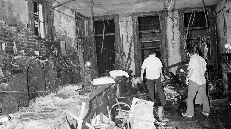A view inside the Up Stairs bar following a fire that left 32 dead and several more injured, seen on June 25, 1973. Most of the victims were found near the windows in the background. (Jack Thornell/AP)
