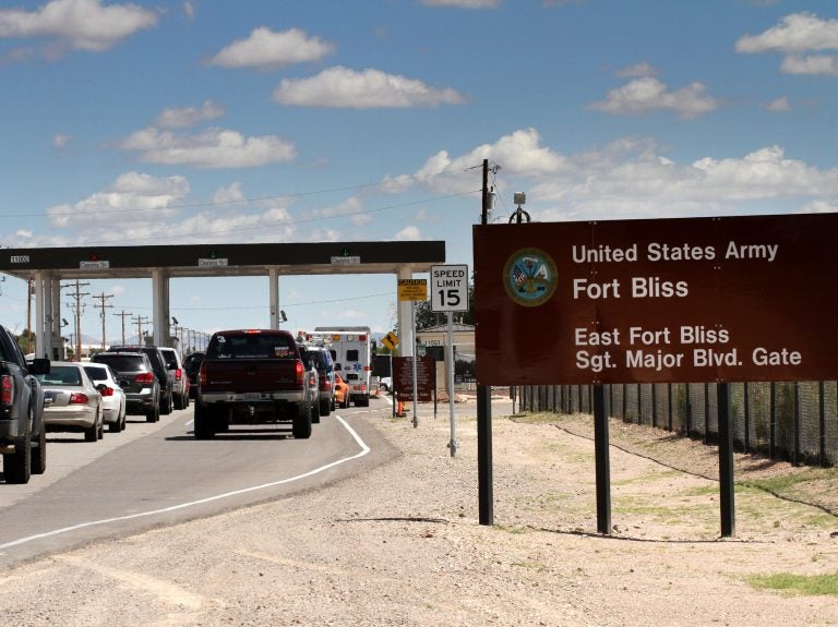 Cars wait to enter Fort Bliss in El Paso, Texas, in 2014. The U.S. Army Base is one of four that likely will be tasked with housing immigrant children following a request Thursday by the Department of Health and Human Services. (Juan Carlos Llorca/AP)