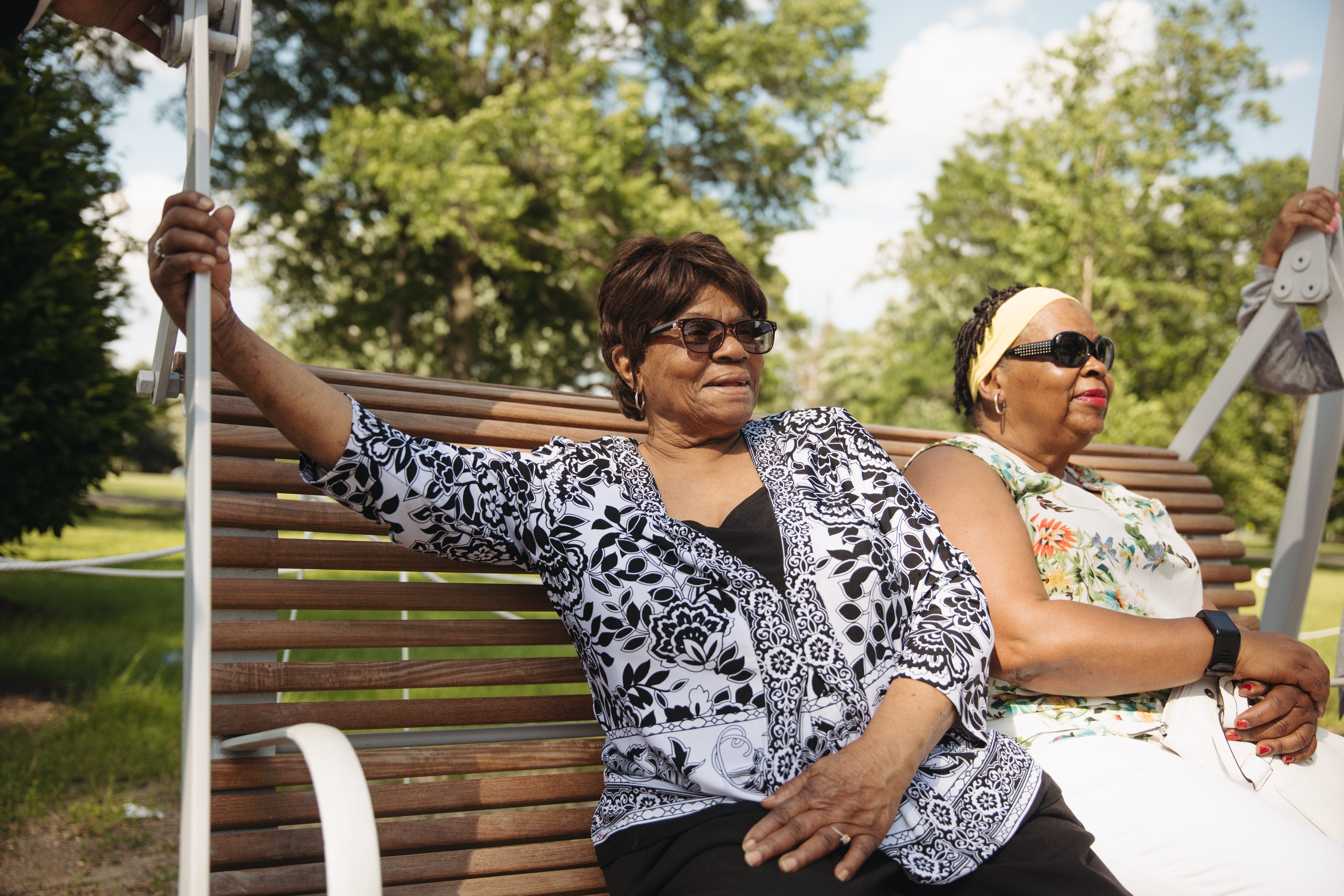 Callalily Cousar and Gloria Pemberton share a swing 