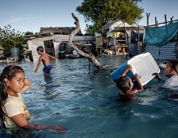 In Kiribati, an island republic in the Central Pacific, large parts of the village Eita (above) have succumbed to flooding from the sea. (Jonas Gratzer/LightRocket via Getty Images)