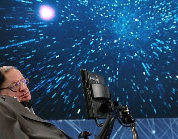 Professor Stephen Hawking sits onstage during the 
