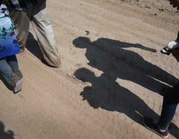 Central American immigrant families walk after crossing from Mexico into the United States to seek asylum in Texas. (John Moore/Getty Images)