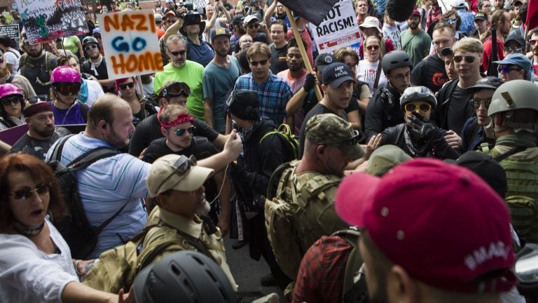 Protesters and counterprotesters clash during the “Unite the Right” rally on Aug. 12 in Charlottesville, Va. One woman died when a car drove into a crowd.
Protesters and counterprotesters clash during the