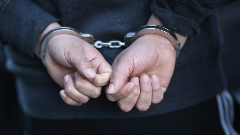 A person is detained by U.S. Immigration and Customs Enforcement officers on April 11 in New York City. (John Moore/Getty Images)