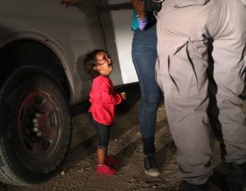 A 2-year-old Honduran girl cries as her mother, who seeks asylum, is detained at the Southern border near McAllen, Texas, in June. (John Moore/Getty Images)