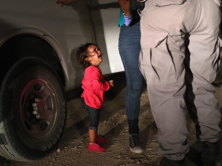 A 2-year-old Honduran girl cries as her mother, who seeks asylum, is detained at the Southern border near McAllen, Texas, in June. (John Moore/Getty Images)