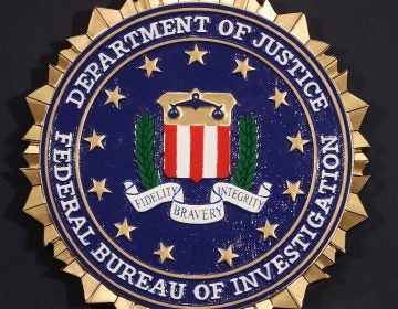 The FBI seal is attached to a podium prior to Director Christopher A. Wray speaking at a news conference at FBI Headquarters, Thursday in Washington, D.C.
(Mark Wilson/Getty Images)