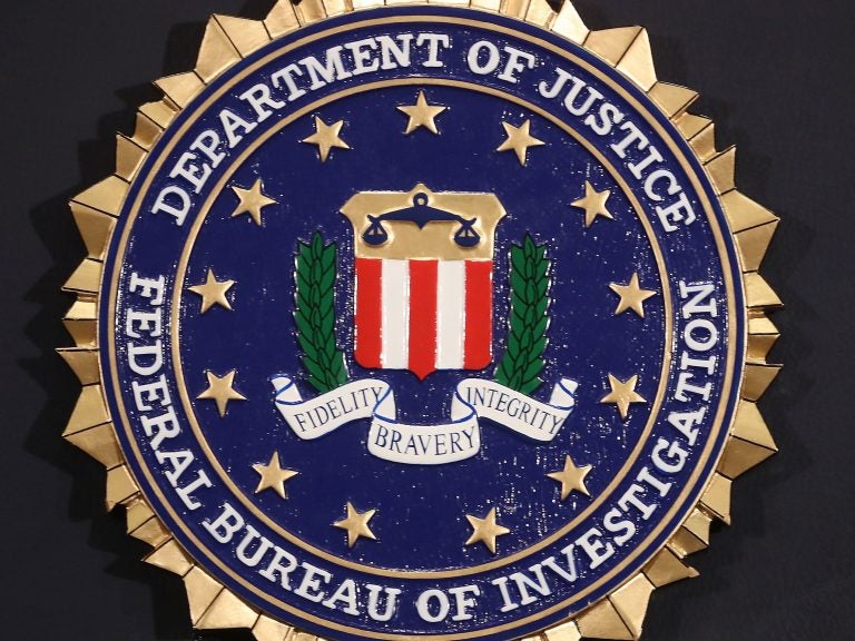 The FBI seal is attached to a podium prior to Director Christopher A. Wray speaking at a news conference at FBI Headquarters, Thursday in Washington, D.C.
(Mark Wilson/Getty Images)