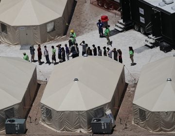 Children and workers are seen at a tent encampment last week n Tornillo, Texas. The Trump administration was using the tent facility to house immigrant children separated from their parents. (Joe Raedle/Getty Images)

