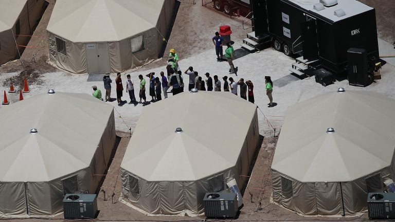 Children and workers are seen at a tent encampment last week n Tornillo, Texas. The Trump administration was using the tent facility to house immigrant children separated from their parents. (Joe Raedle/Getty Images)
